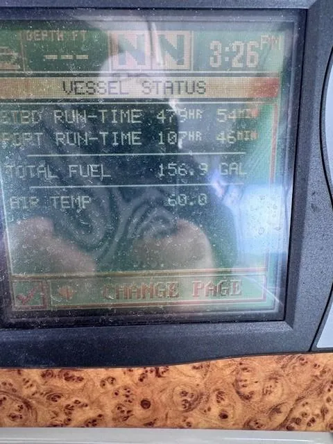 Slide: The Image of Close-up of a 2006 Formula 34 PC vessel status display showing runtime and fuel data. - 4
