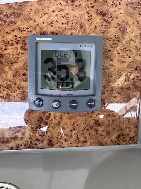 Slide: The Image of Raymarine depth gauge on 2006 Formula 34 PC boat dashboard, showing 35.7 feet. - 5