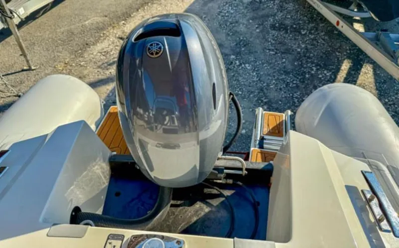 Slide: The Image of 2023 Northstar Axis 4.8 RIB boat with Yamaha outboard motor, rear view. - 6