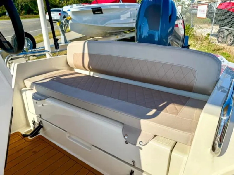 Slide: The Image of 2023 Northstar Axis 4.8 RIB boat with beige cushioned seating. - 8