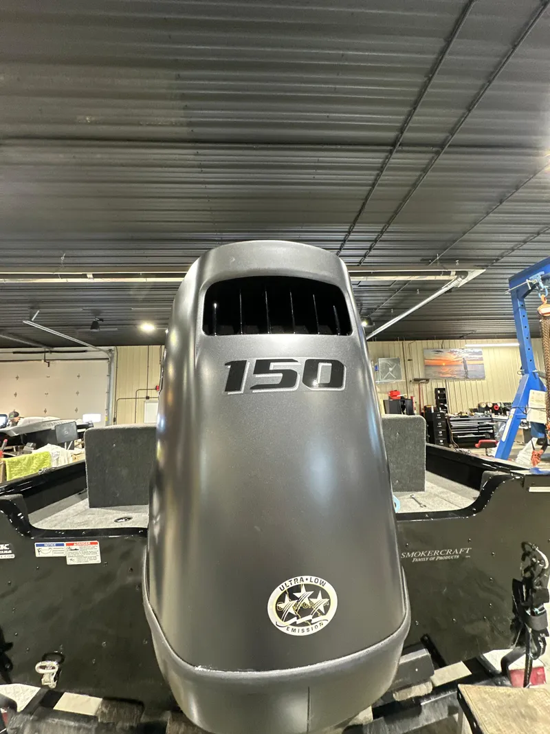 Slide: The Image of 2025 Smoker Craft Adventurer 188 DC with 150 HP engine in a workshop setting. - 10