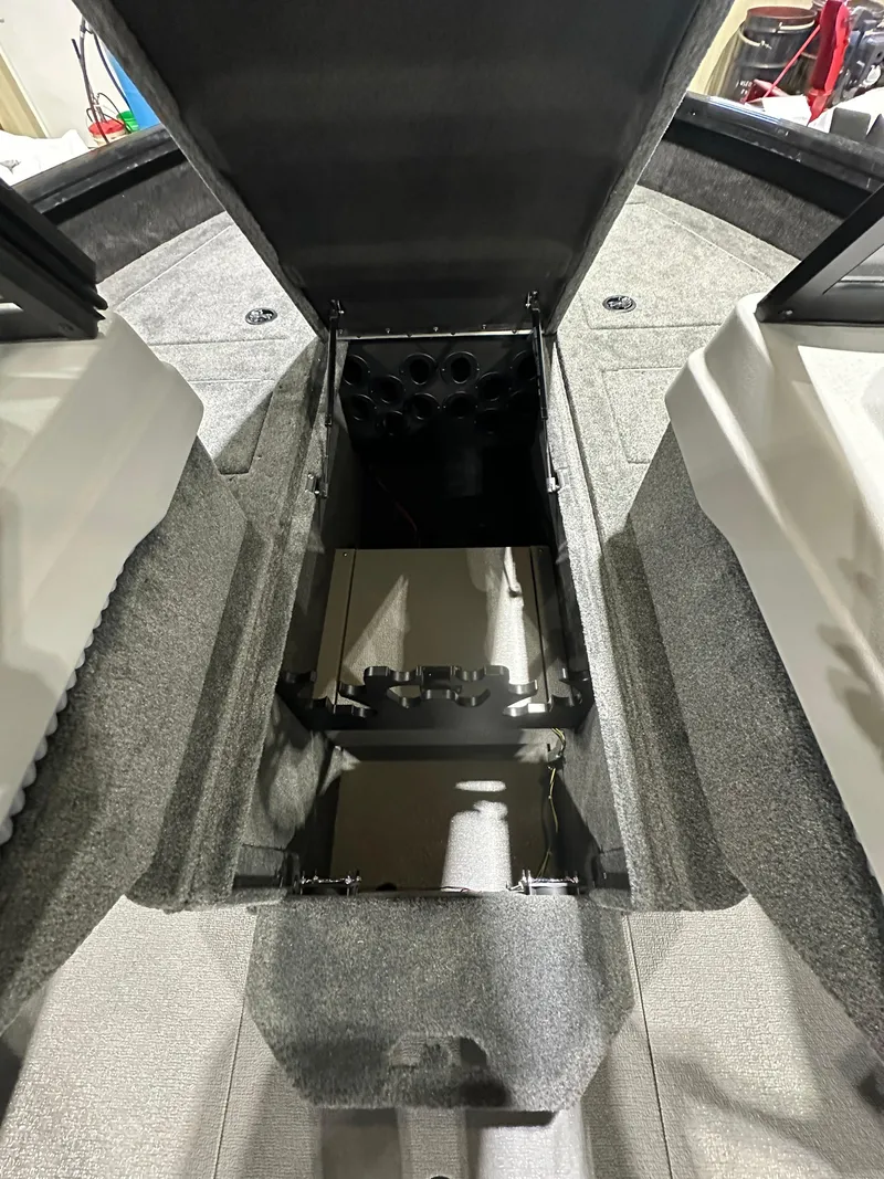 Slide: The Image of 2025 Smoker Craft Adventurer 188 DC boat interior storage compartment. - 8