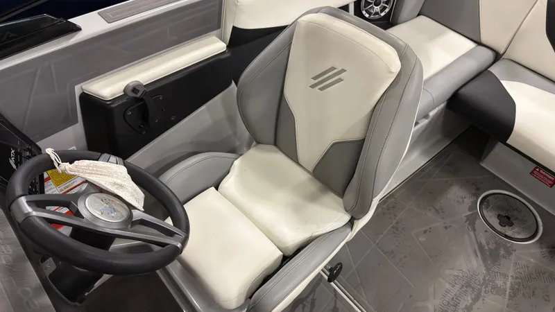 Slide: The Image of Interior of a 2021 ATX Surf Boats 20 Type-S with steering wheel. - 16