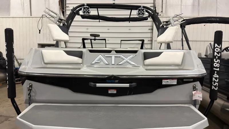 Slide: The Image of Rear view of a 2021 ATX Surf Boats 20 Type-S indoors. - 2