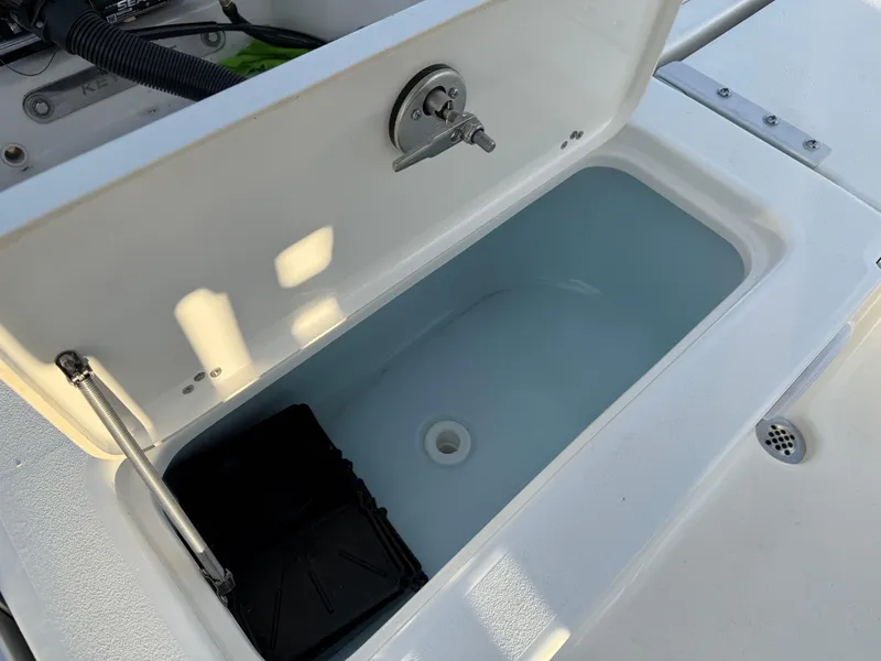 Slide: The Image of Open storage compartment on 2025 Key West 230 Bay Reef boat. - 10
