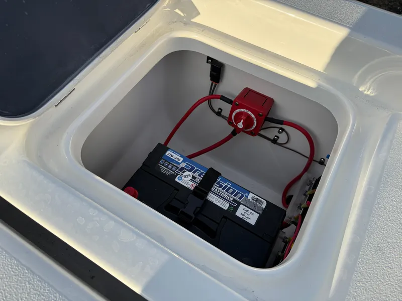 Slide: The Image of Battery compartment of 2025 Key West 230 Bay Reef boat with wiring and switch. - 11