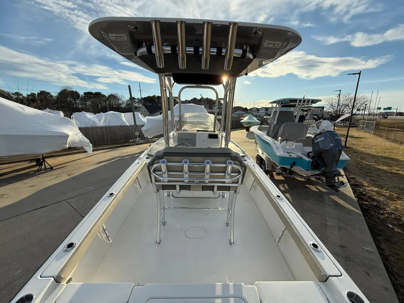 Slide: The Image of 2025 Key West 230 Bay Reef boat, docked, under a clear sky. - 13