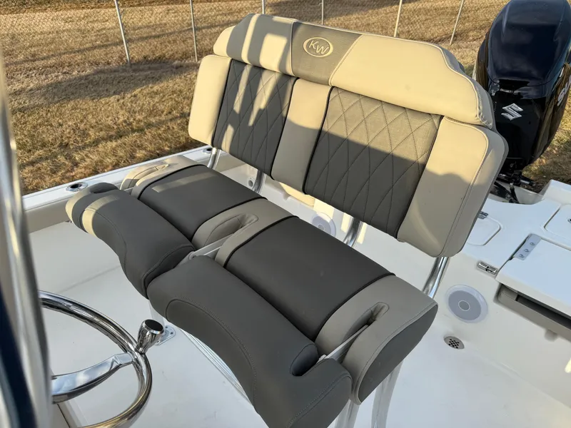 Slide: The Image of 2025 Key West 230 Bay Reef boat seat with cushioned backrest and armrests. - 17