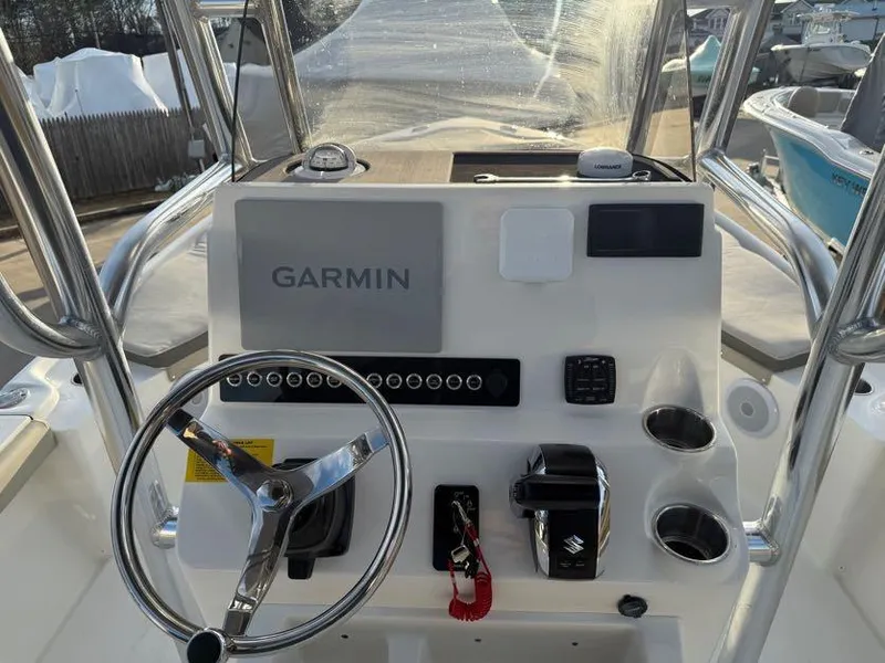 Slide: The Image of 2025 Key West 230 Bay Reef boat console with Garmin navigation system and steering wheel. - 18