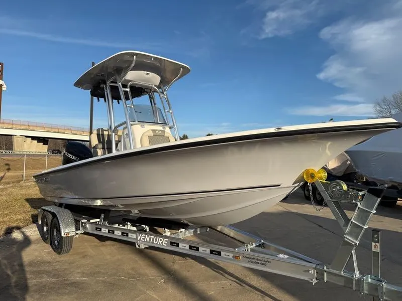 Slide: The Image of 2025 Key West 230 Bay Reef boat on trailer under clear sky. - 3