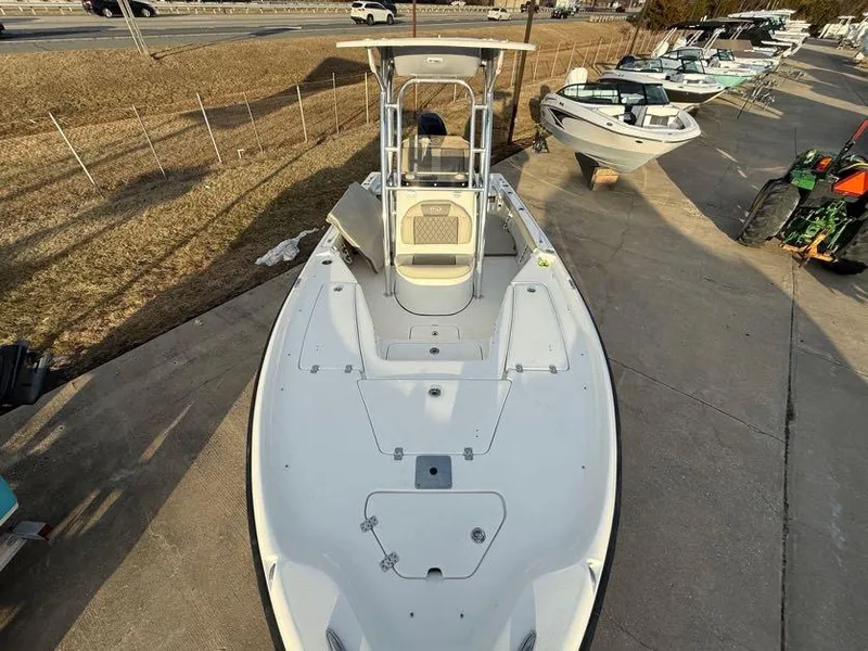 Slide: The Image of 2025 Key West 230 Bay Reef boat on display at a marina. - 30