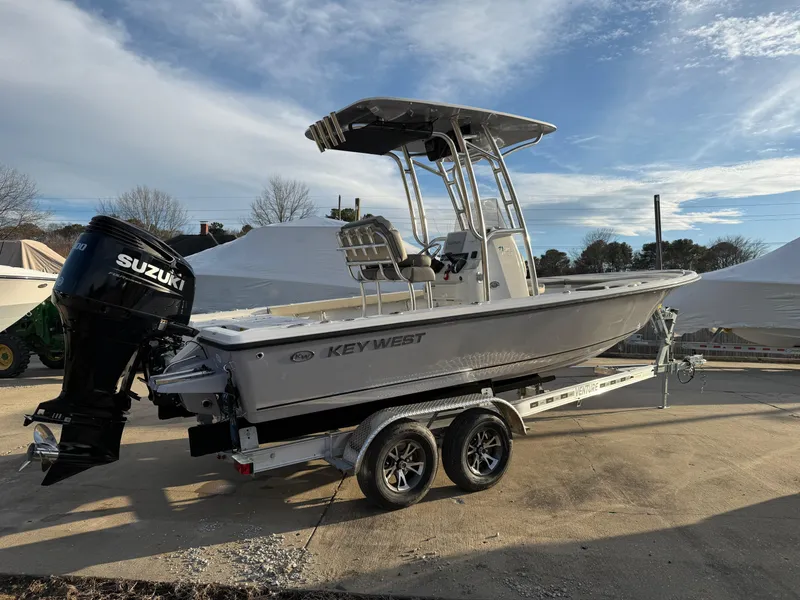 Slide: The Image of 2025 Key West 230 Bay Reef boat on trailer with Suzuki outboard motor. - 4