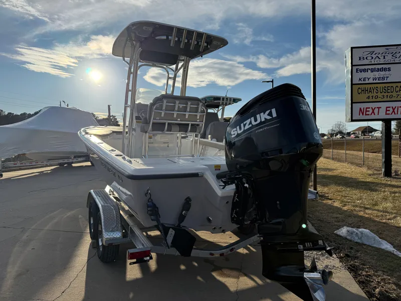 Slide: The Image of 2025 Key West 230 Bay Reef boat with Suzuki engine on trailer, outdoor setting. - 6
