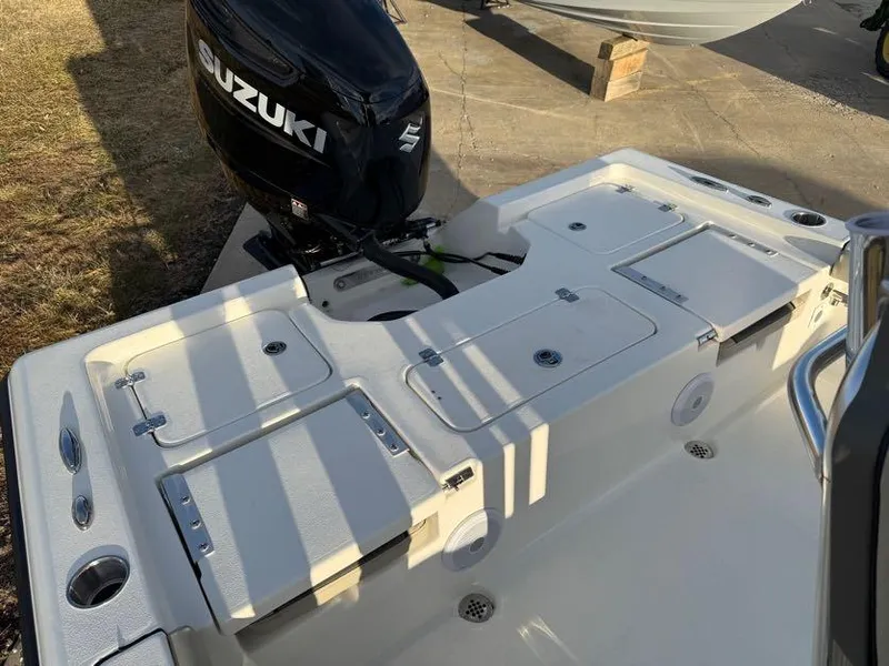 Slide: The Image of 2025 Key West 230 Bay Reef boat with Suzuki outboard motor, rear deck view. - 8