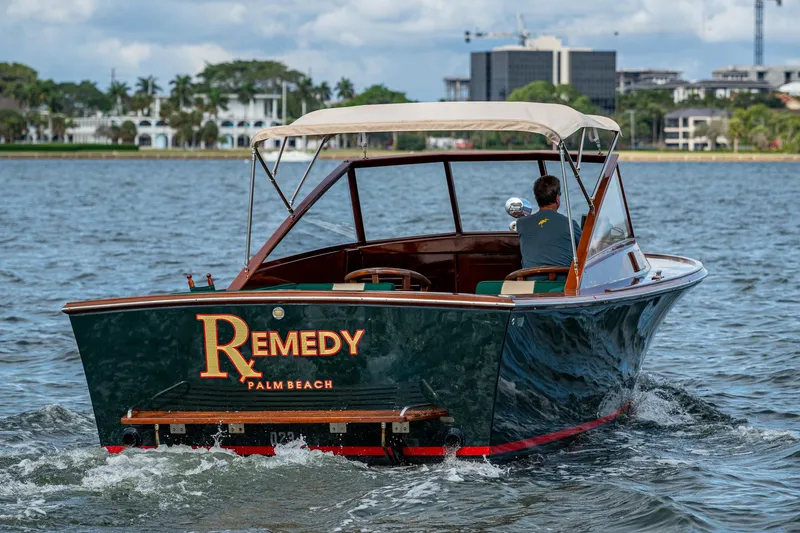 Slide: The Image of 2010 Blackfin 28 CC boat named "Remedy" cruising on water near Palm Beach. - 13