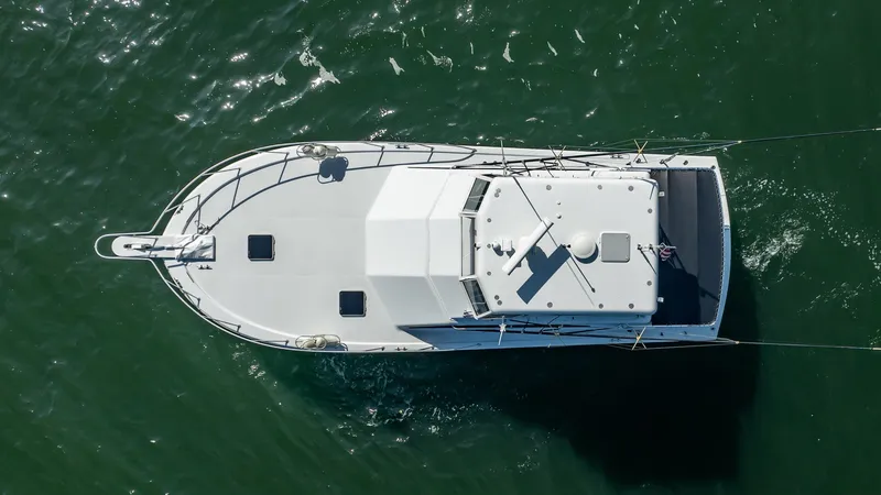 Slide: The Image of Overhead view of 1991 Jersey 42 Convertible Sportfisherman boat on water. - 14