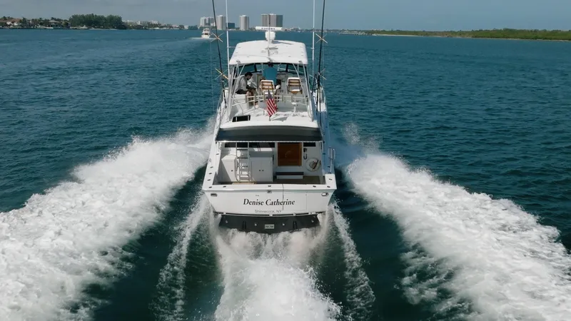 Slide: The Image of 1991 Jersey 42 Convertible Sportfisherman cruising on open water, rear view. - 15