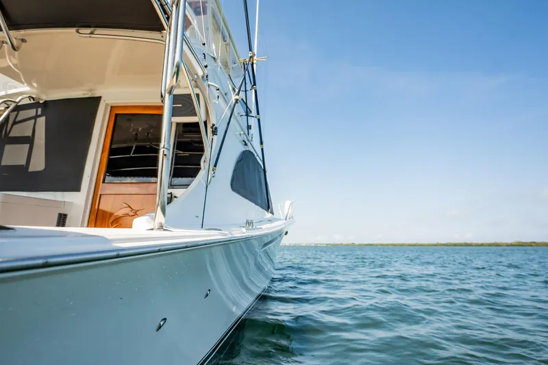 Slide: The Image of 1991 Jersey 42 Convertible Sportfisherman on calm water under clear blue sky. - 19