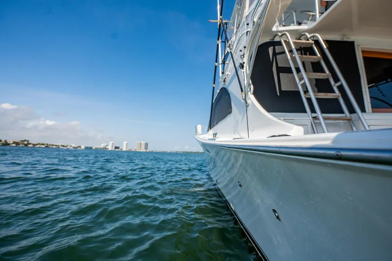 Slide: The Image of 1991 Jersey 42 Convertible Sportfisherman on calm water, clear sky background. - 20