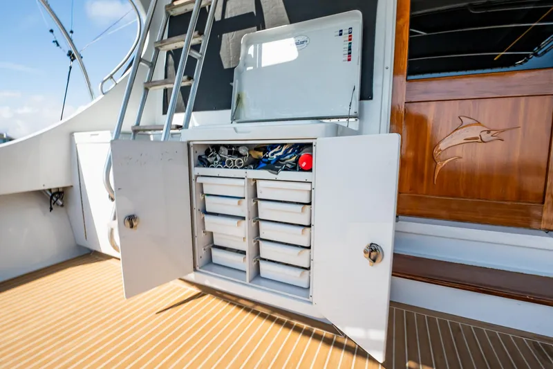 Slide: The Image of 1991 Jersey 42 Convertible Sportfisherman with open storage cabinet on deck. - 21