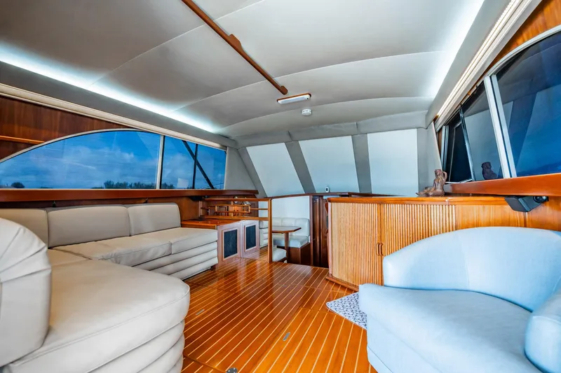 Slide: The Image of Luxurious interior of 1991 Jersey 42 Convertible Sportfisherman with elegant seating and wood finishes. - 24