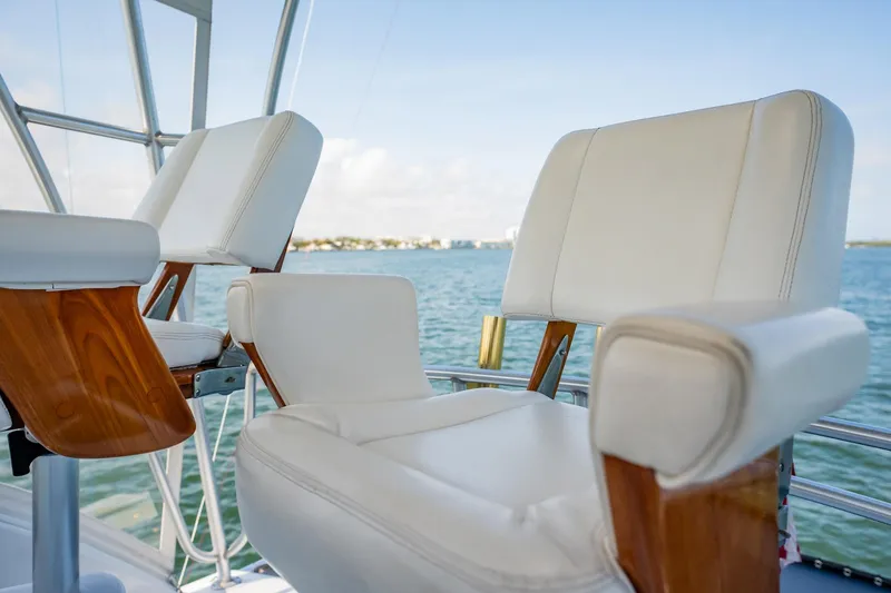 Slide: The Image of Luxury seating on 1991 Jersey 42 Convertible Sportfisherman yacht, overlooking serene waters. - 36