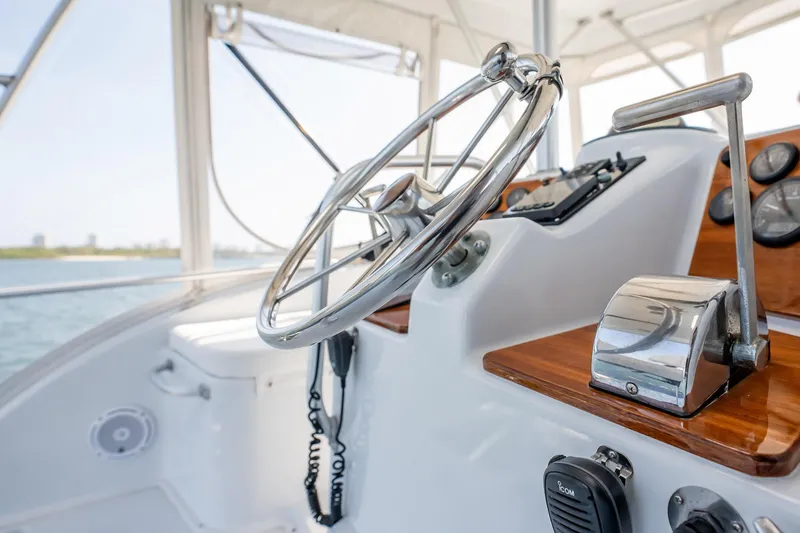 Slide: The Image of 1991 Jersey 42 Convertible Sportfisherman helm with steering wheel and controls. - 38