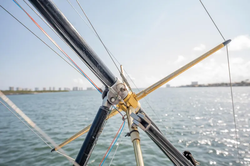 Slide: The Image of Close-up of rigging on a 1991 Jersey 42 Convertible Sportfisherman boat, with water in background. - 42