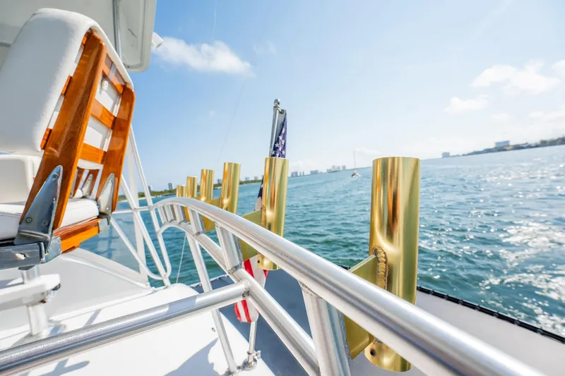 Slide: The Image of 1991 Jersey 42 Convertible Sportfisherman yacht deck with ocean view and clear sky. - 43