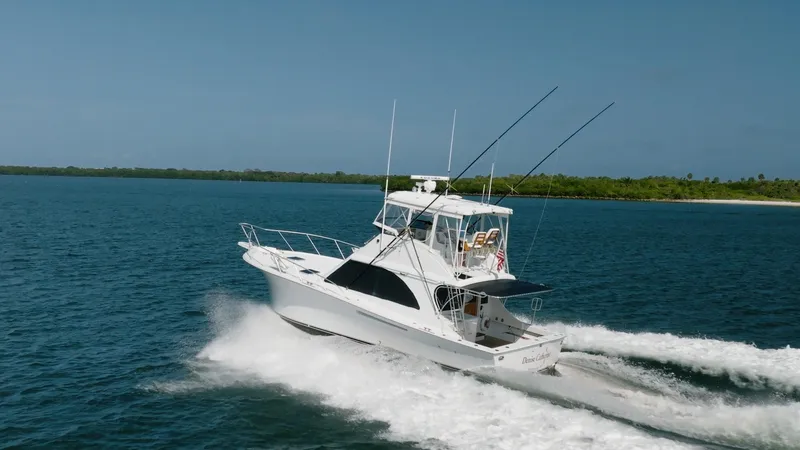 Slide: The Image of 1991 Jersey 42 Convertible Sportfisherman cruising on open water. - 6