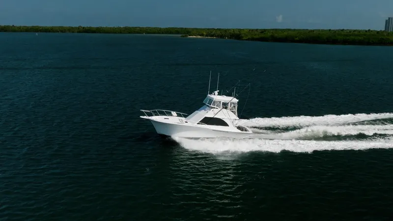 Slide: The Image of 1991 Jersey 42 Convertible Sportfisherman cruising on open water. - 7