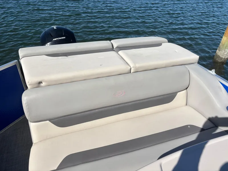 Slide: The Image of 2022 Princecraft Vectra 23 boat with comfortable seating and Mercury outboard motor on water. - 18