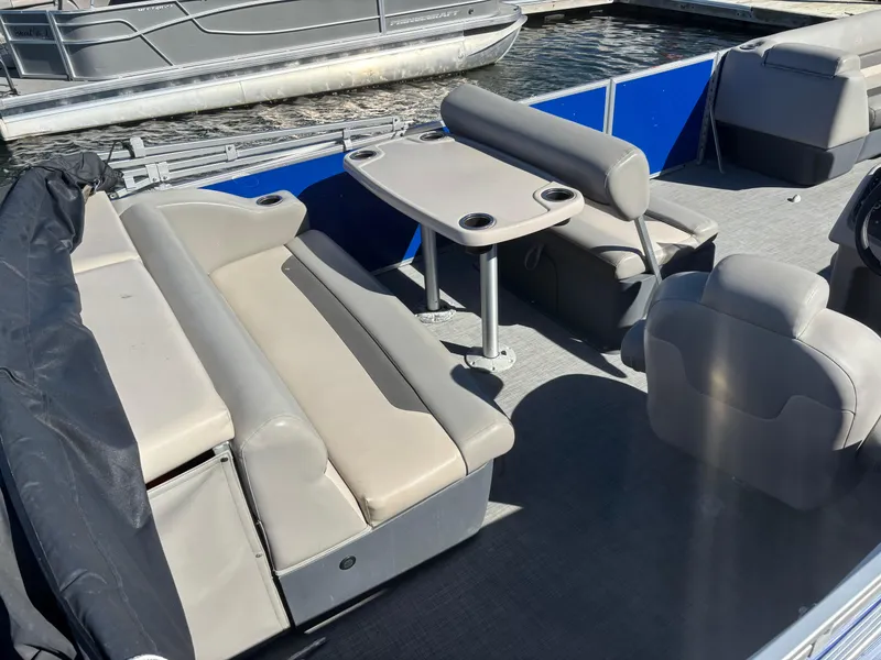 Slide: The Image of 2022 Princecraft Vectra 23 pontoon boat interior with seating and table. - 4