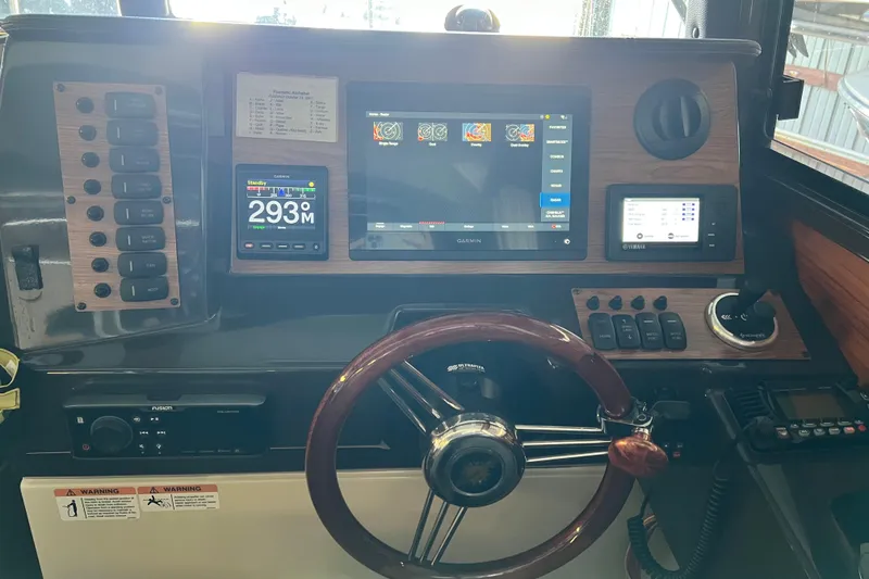 Slide: The Image of Dashboard of a 2020 Ranger Tugs 27 boat with navigation and control systems. - 11