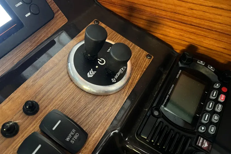 Slide: The Image of Control panel of a 2020 Ranger Tugs 27 boat with joystick and radio. - 12