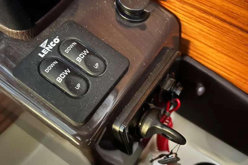 Slide: The Image of Control panel of a 2020 Ranger Tugs 27 boat with Lenco trim tab switches. - 13