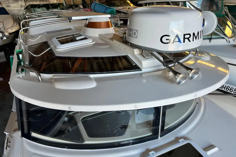 Slide: The Image of 2020 Ranger Tugs 27 boat with Garmin radar and dual horns on deck. - 18