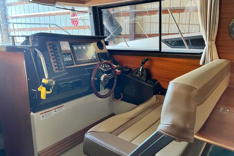 Slide: The Image of 2020 Ranger Tugs 27 helm with modern controls and navigation equipment. - 9