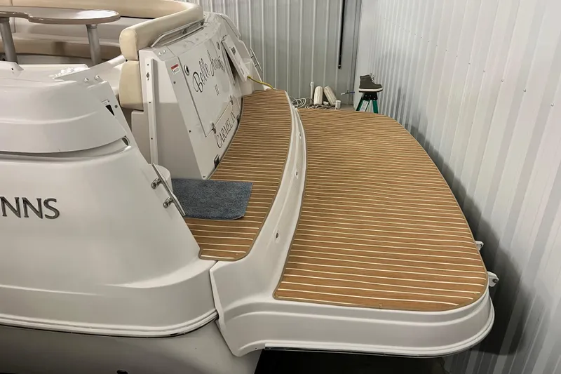 Slide: The Image of 2008 Four Winns V378 boat with wooden deck in storage. - 11