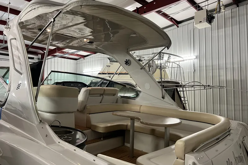 Slide: The Image of 2008 Four Winns V378 yacht interior with seating and table in a storage facility. - 12