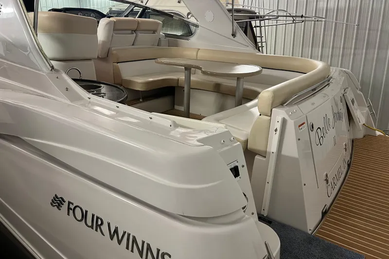 Slide: The Image of 2008 Four Winns V378 yacht interior with seating and table, showcasing luxury design. - 13