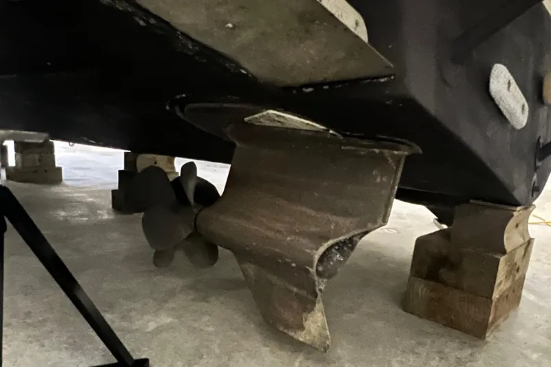 Slide: The Image of 2008 Four Winns V378 boat propeller and hull on blocks. - 2