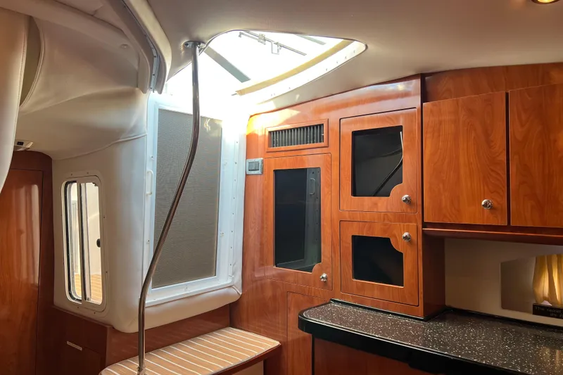 Slide: The Image of Interior of 2008 Four Winns V378 yacht with wood cabinetry and skylight. - 25