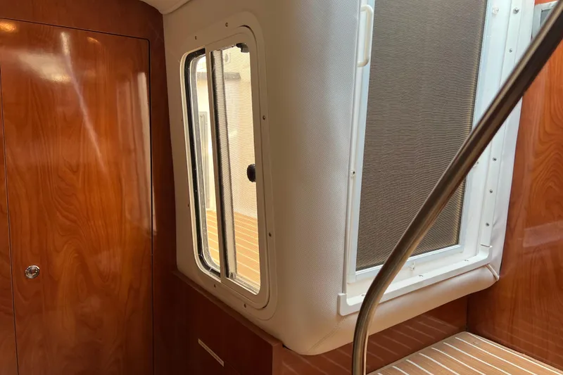 Slide: The Image of Interior of 2008 Four Winns V378 boat with wooden paneling and window. - 26