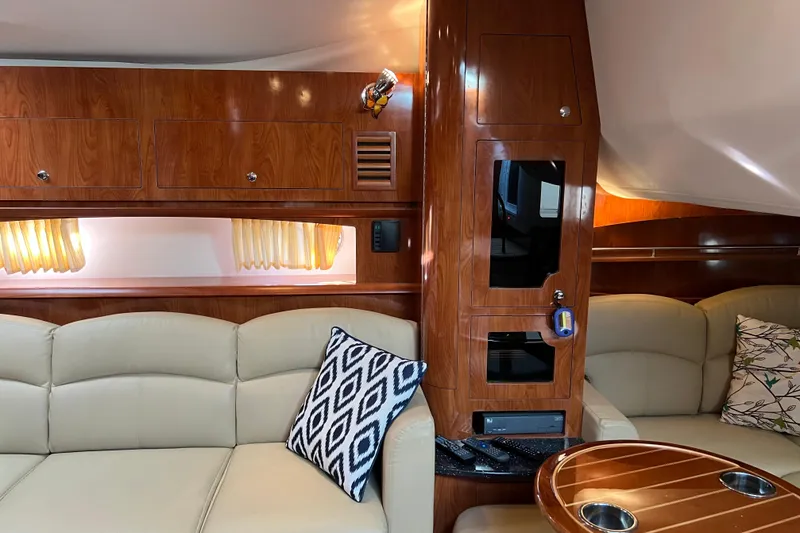 Slide: The Image of Interior of 2008 Four Winns V378 yacht with elegant wood finish and plush seating. - 27