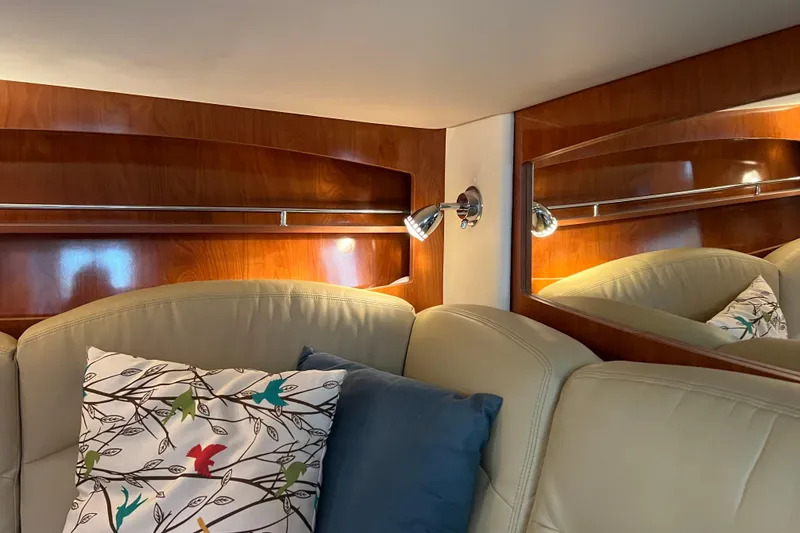 Slide: The Image of Interior of 2008 Four Winns V378 yacht with plush seating and decorative pillows. - 32