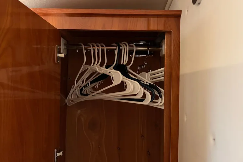 Slide: The Image of Wooden closet with hangers inside a 2008 Four Winns V378 boat. - 33