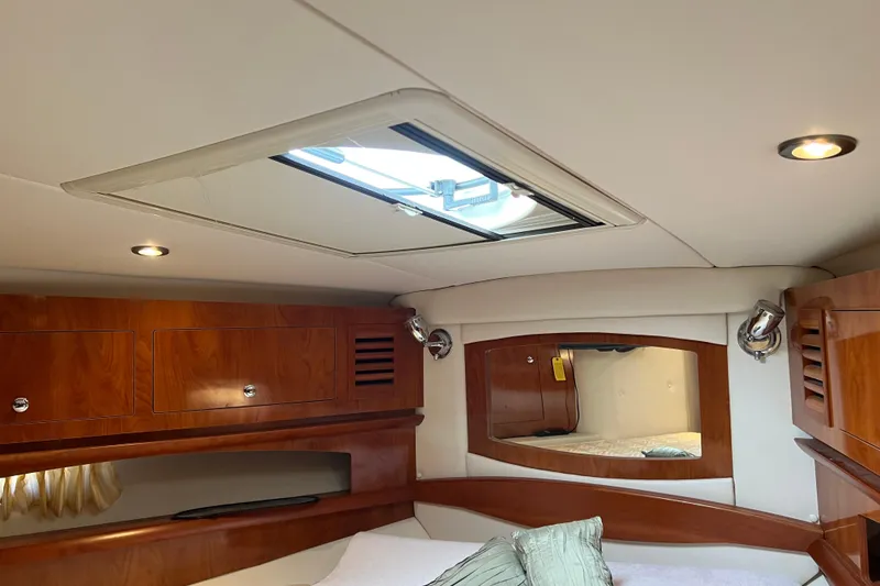 Slide: The Image of Interior cabin of 2008 Four Winns V378 yacht with wood finish and skylight. - 36