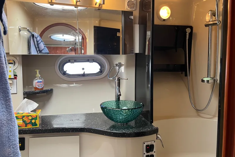 Slide: The Image of Luxurious bathroom in 2008 Four Winns V378 yacht with modern glass sink and shower. - 40
