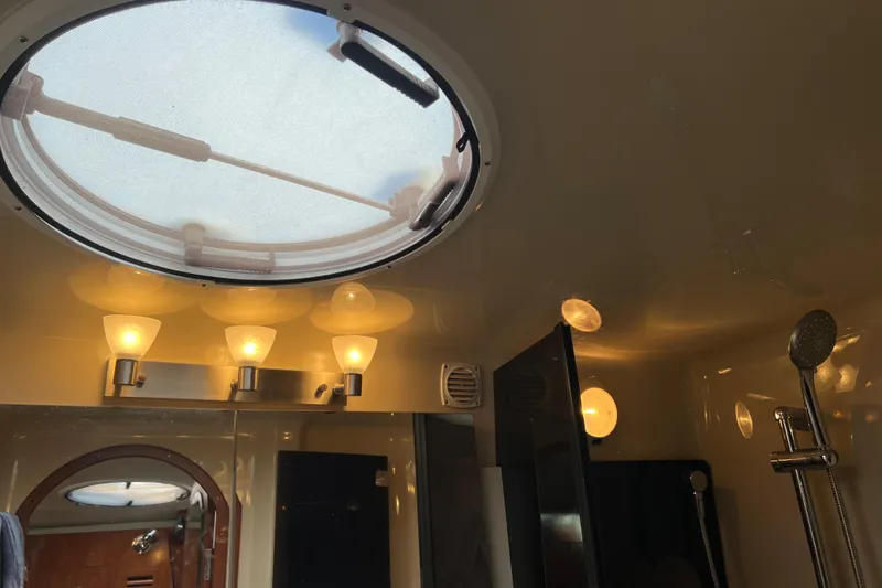 Slide: The Image of Interior of 2008 Four Winns V378 yacht bathroom with skylight and modern lighting. - 41